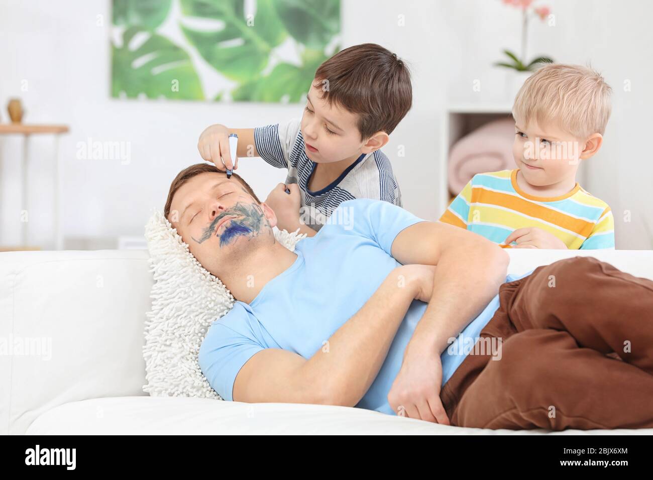 Little Children Painting Their Father S Face While He Sleeping April Fool S Day Prank Stock Photo Alamy