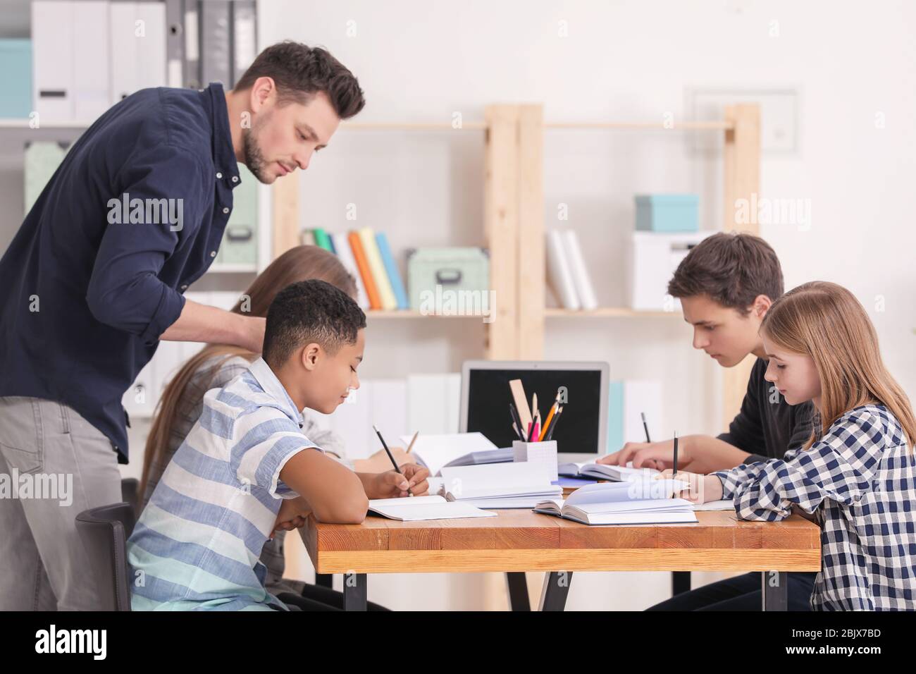 teacher doing homework in class