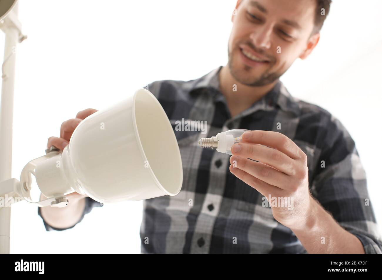 Man changing the bulb hi-res stock photography and images - Alamy