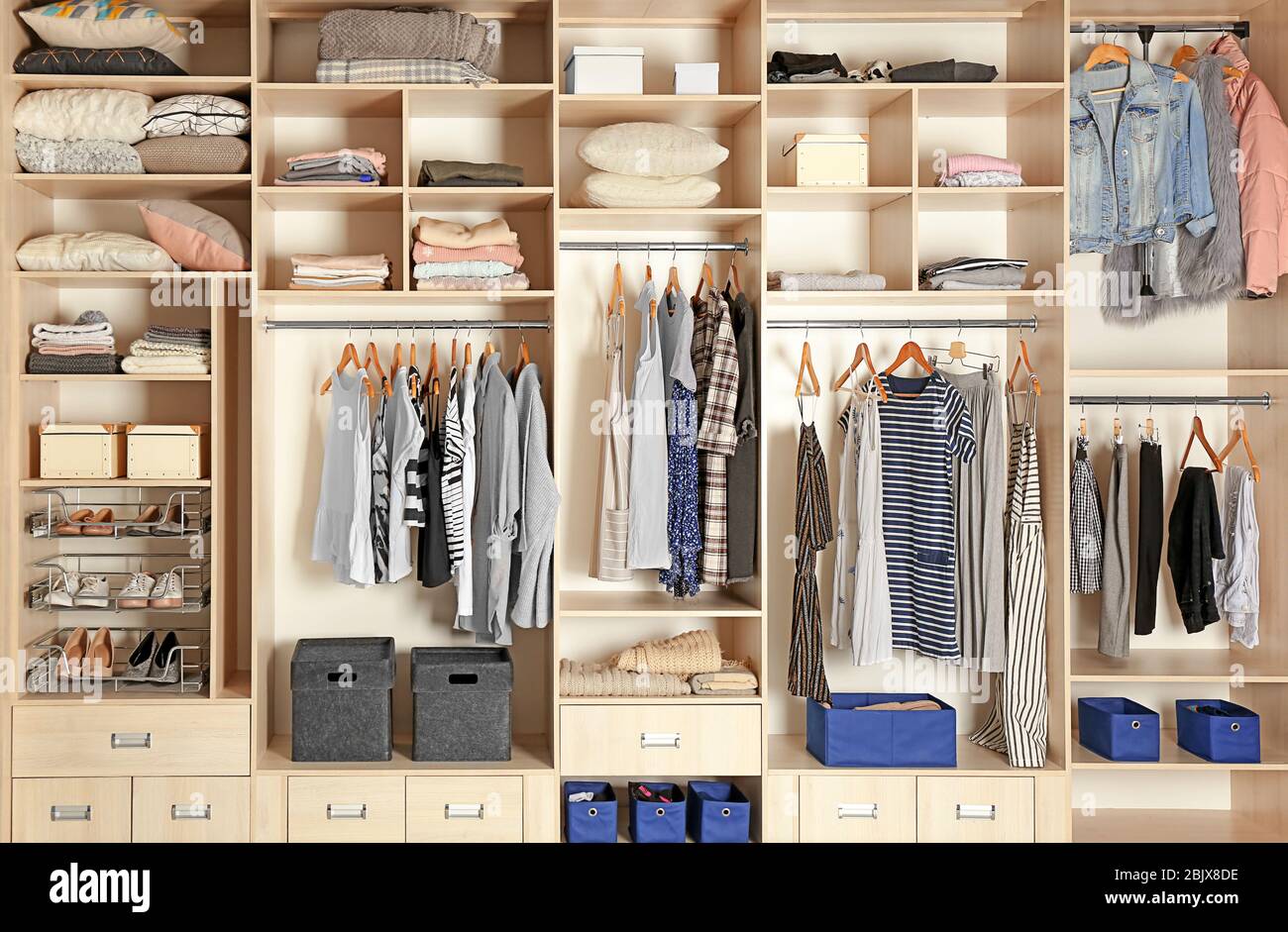 Large wardrobe closet with different clothes, shoes and home stuff Stock  Photo - Alamy