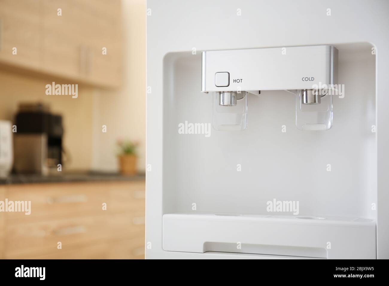 Modern water cooler in kitchen Stock Photo Alamy