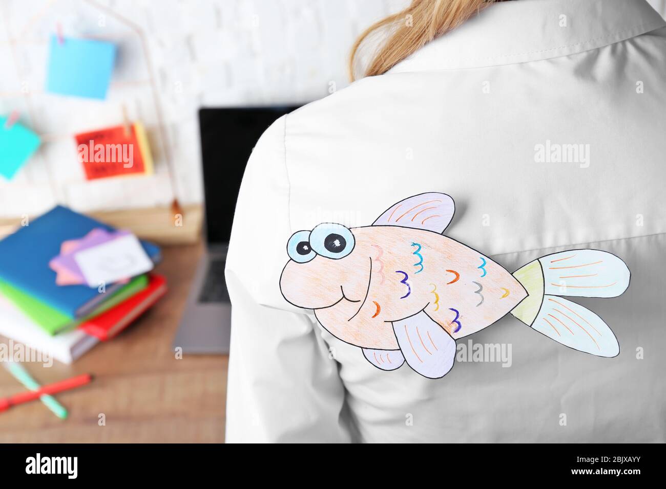 Paper fish on woman's back, closeup. April fool's day celebration Stock ...