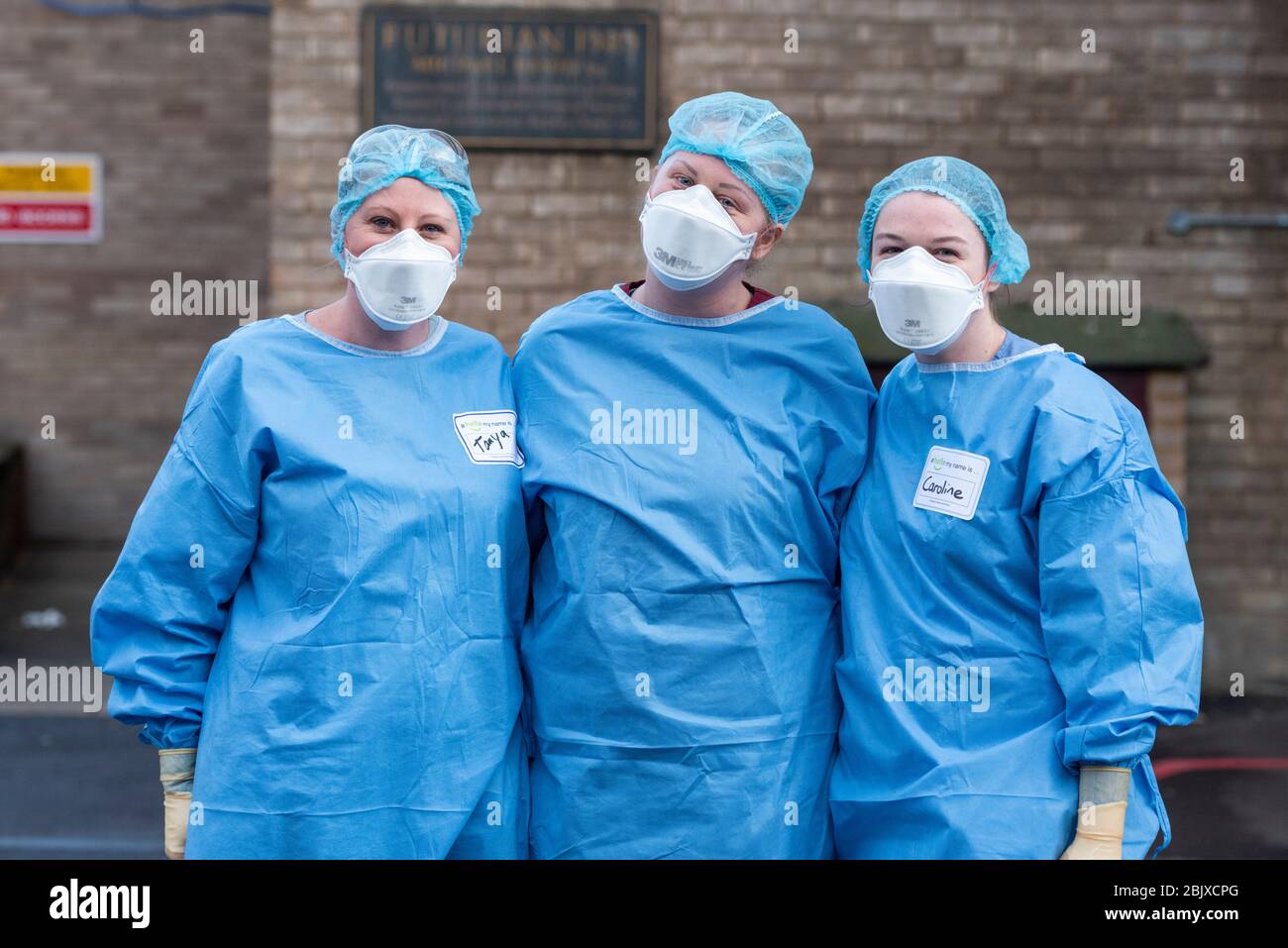 Addenbrookes Hospital Cambridge, UK. 30th Apr, 2020. Three nurses wearing PPE outside the Accident and Emergency Department during the clap to thank staff for their work during the Covid 19 coronavirus outbreak. The Magpas Air Ambulance flew over the hospital as a mark of respect. Credit: Julian Eales/Alamy Live News Stock Photo