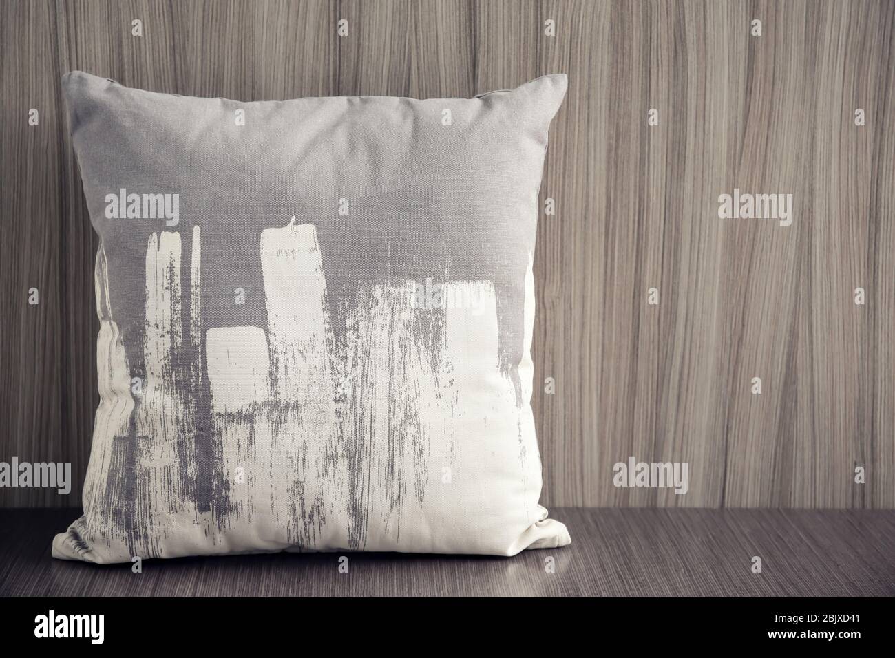 Stylish soft pillow on table Stock Photo