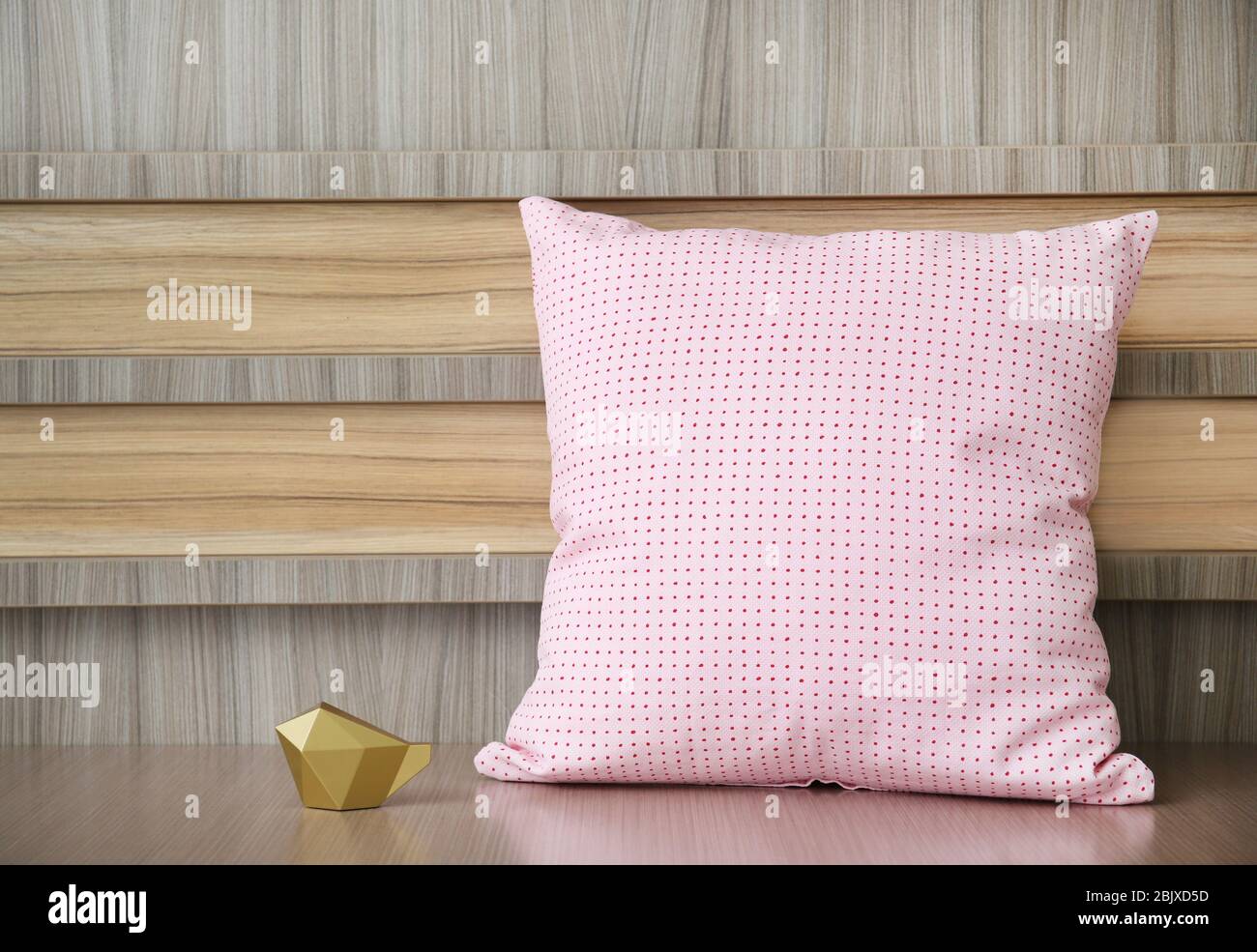 Stylish soft pillow on table Stock Photo