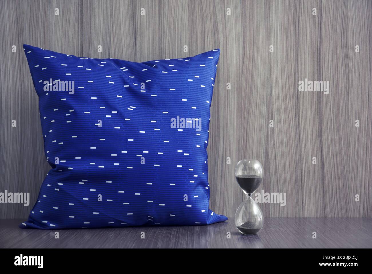 Stylish soft pillow on table Stock Photo