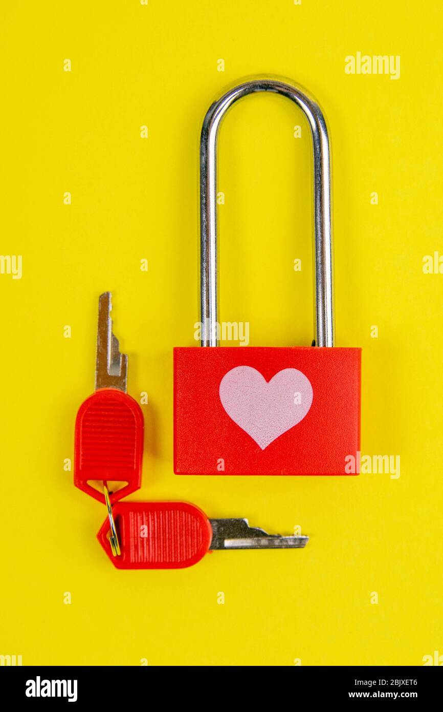 Red lock with drawing heart and key on yallow background Stock Photo ...