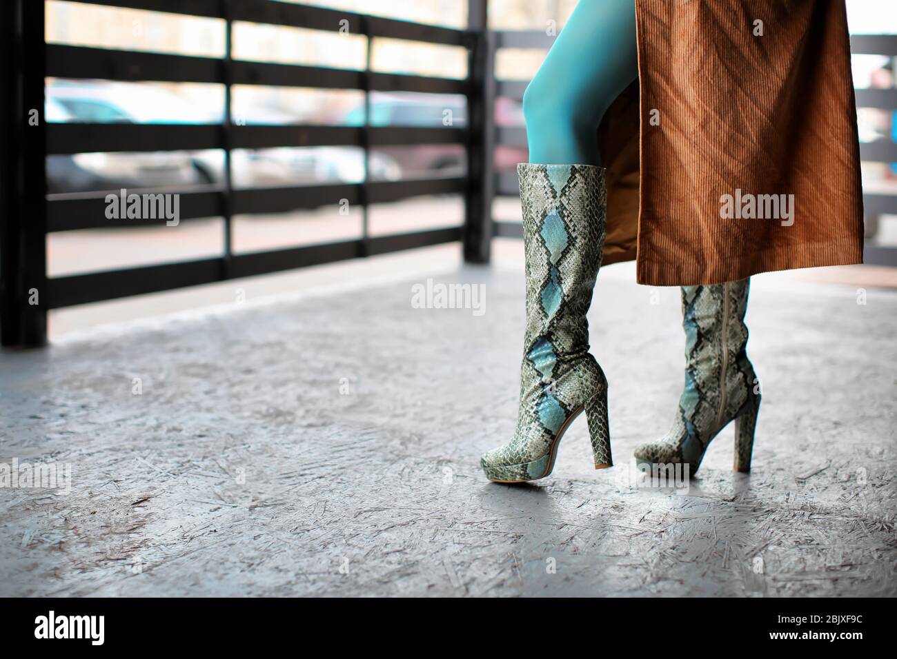 Stylish woman in snakeskin shoes outdoors Stock Photo