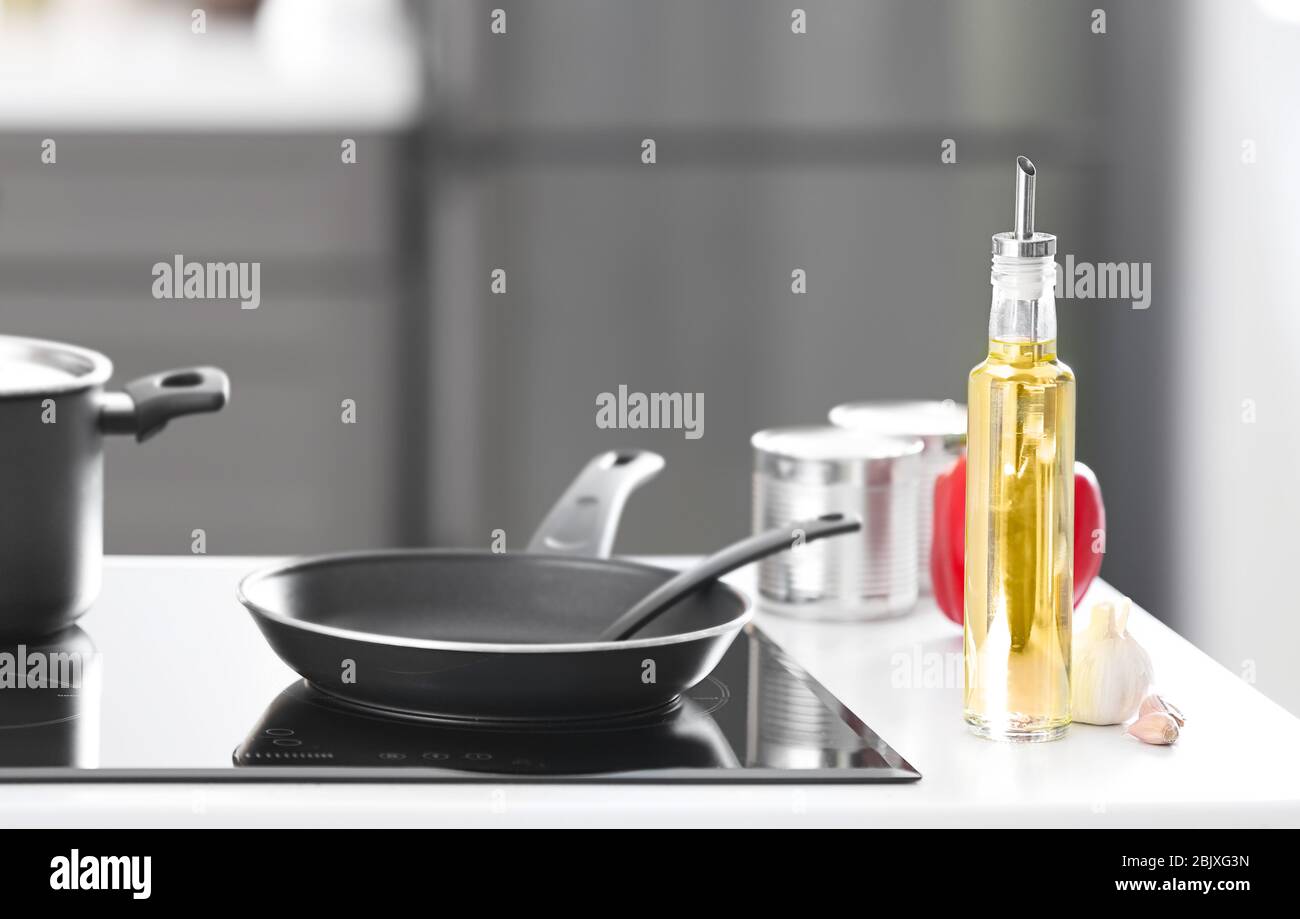 Glass bottle of cooking oil on kitchen counter Stock Photo Alamy