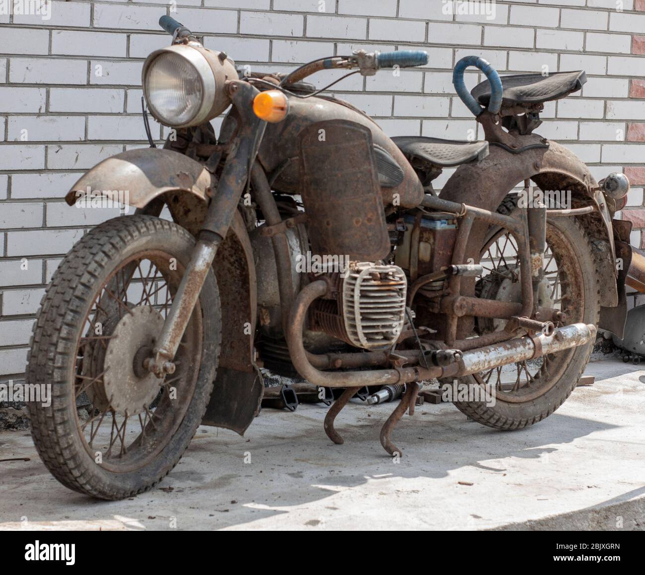 Retro moto, old antique bike covered with rust. Stock Photo