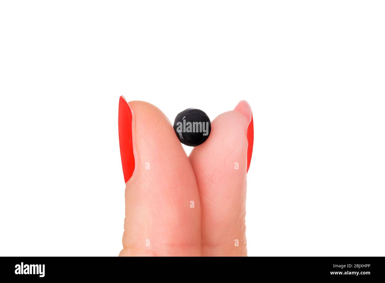 Shilajit, Mumijo pills in woman fingers on white background. Natural remedy  Stock Photo - Alamy
