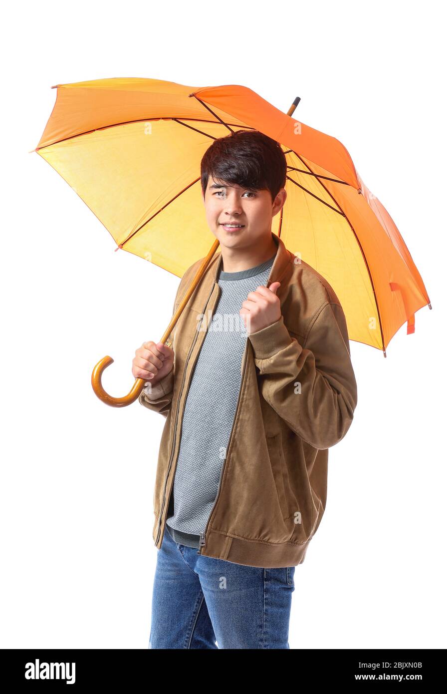 Handsome Asian man with umbrella on white background Stock Photo - Alamy