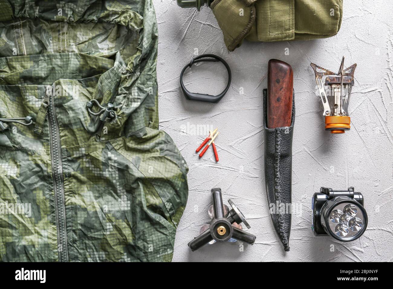 Set of items for camping on grey background Stock Photo