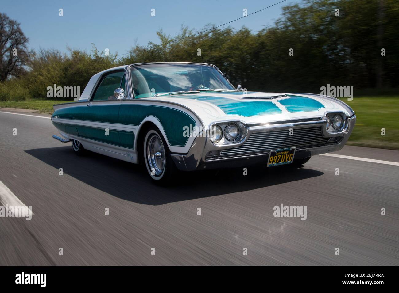 Ford Thunderbird low rider with LA Gang style girl Stock Photo