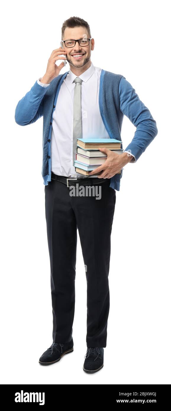 Handsome male teacher talking by phone on white background Stock Photo ...
