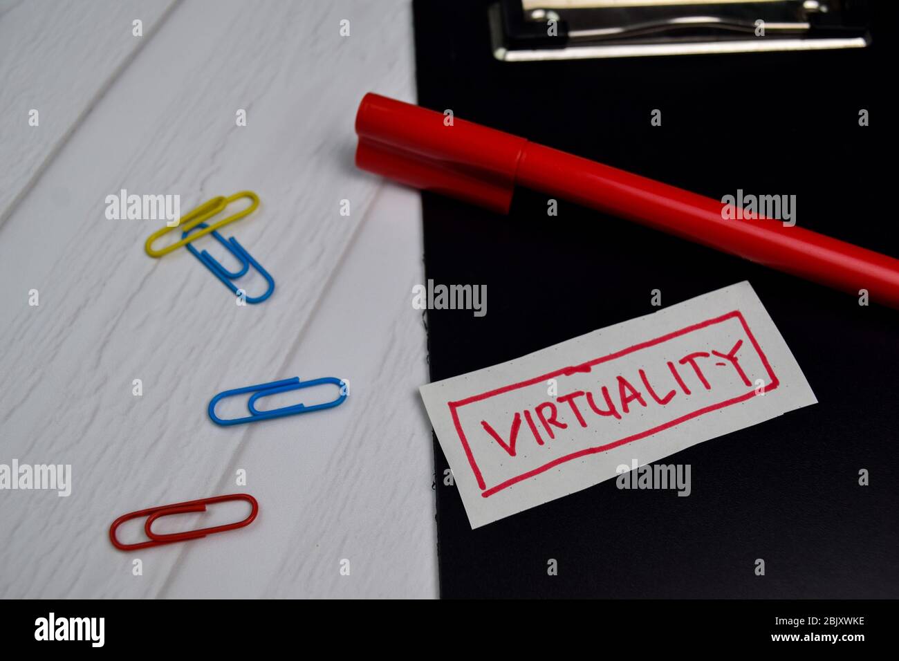 Virtuality write on sticky notes isolated on office desk Stock Photo