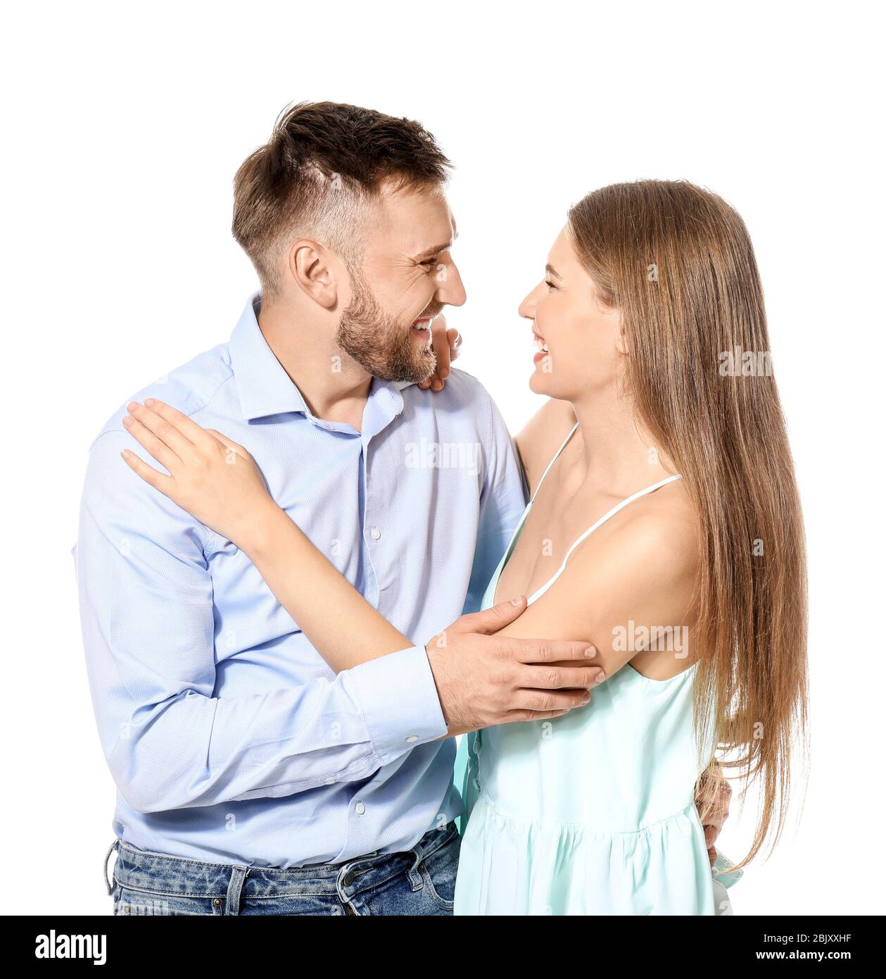 Happy young couple in love on white background Stock Photo - Alamy