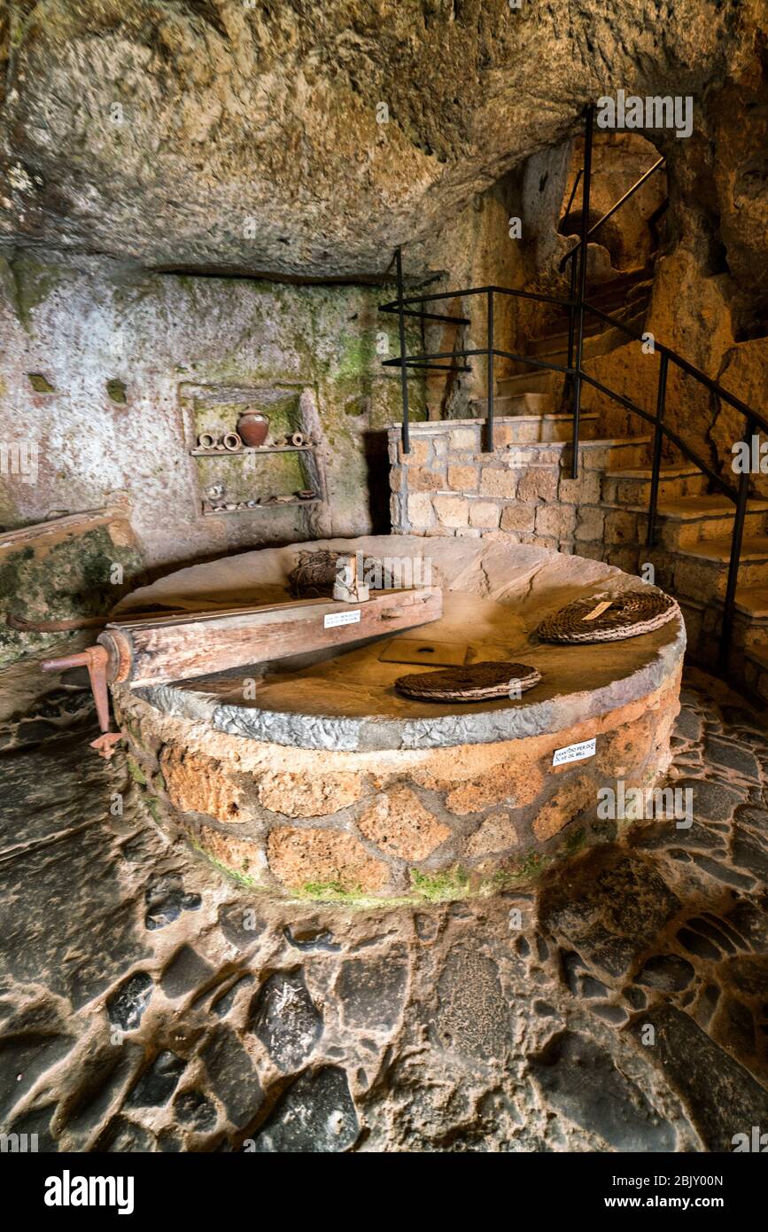 Wine cellar and olive oil press inside the Cave of Saint Bonaventure in Cività di Bagnoregio, Civita Bagno, an ancient Etruscan hilltop village perche Stock Photo