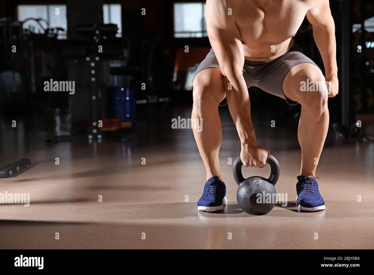 Sporty young man kettlebell hi-res stock photography and images - Alamy