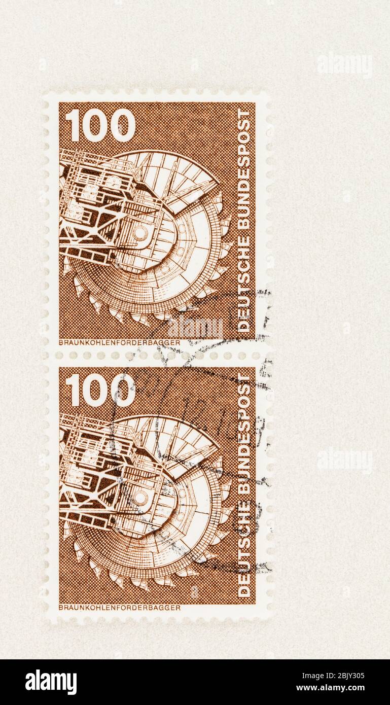 SEATTLE WASHINGTON - April 30, 2020:  100 pf  German stamps featuring lignite excavator and conveyor, of Industry and Technology issue. Scott # 1179 Stock Photo