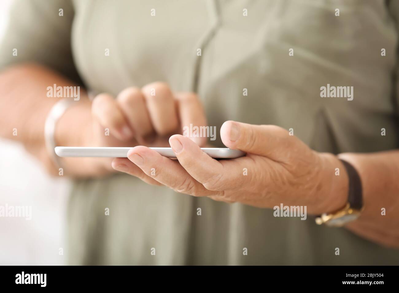 Elderly woman with modern tablet computer, closeup Stock Photo