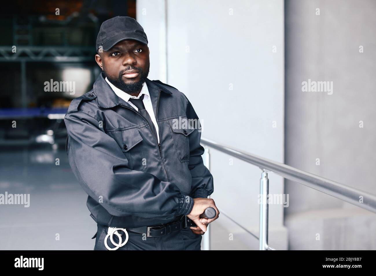 African-American security guard in building Stock Photo - Alamy