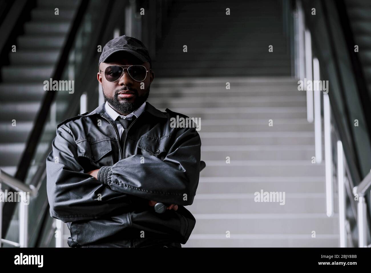 African-American security guard in building Stock Photo - Alamy