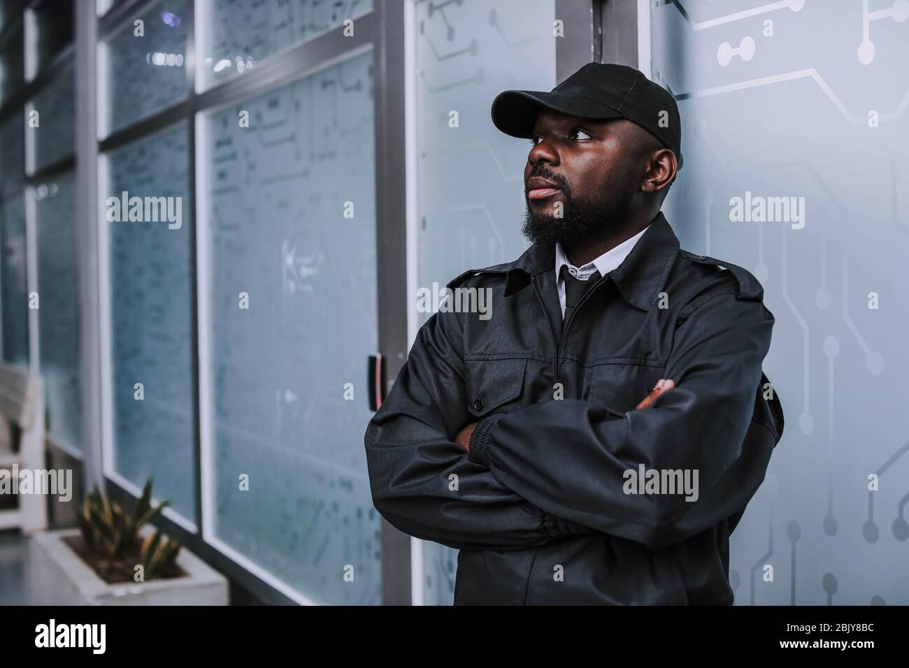 African-American security guard in building Stock Photo - Alamy