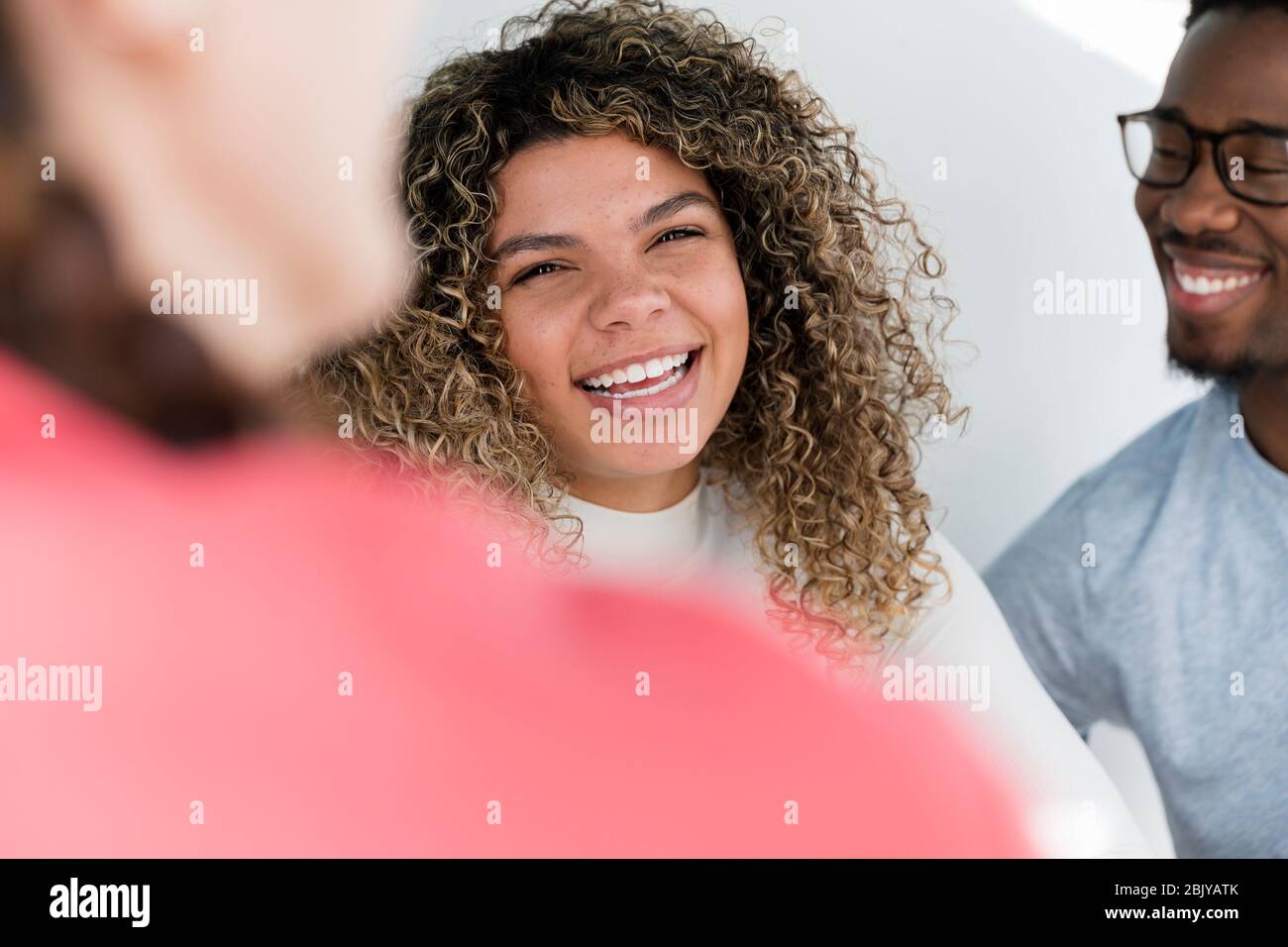Portrait of woman hanging out with friendsÂ Stock Photo
