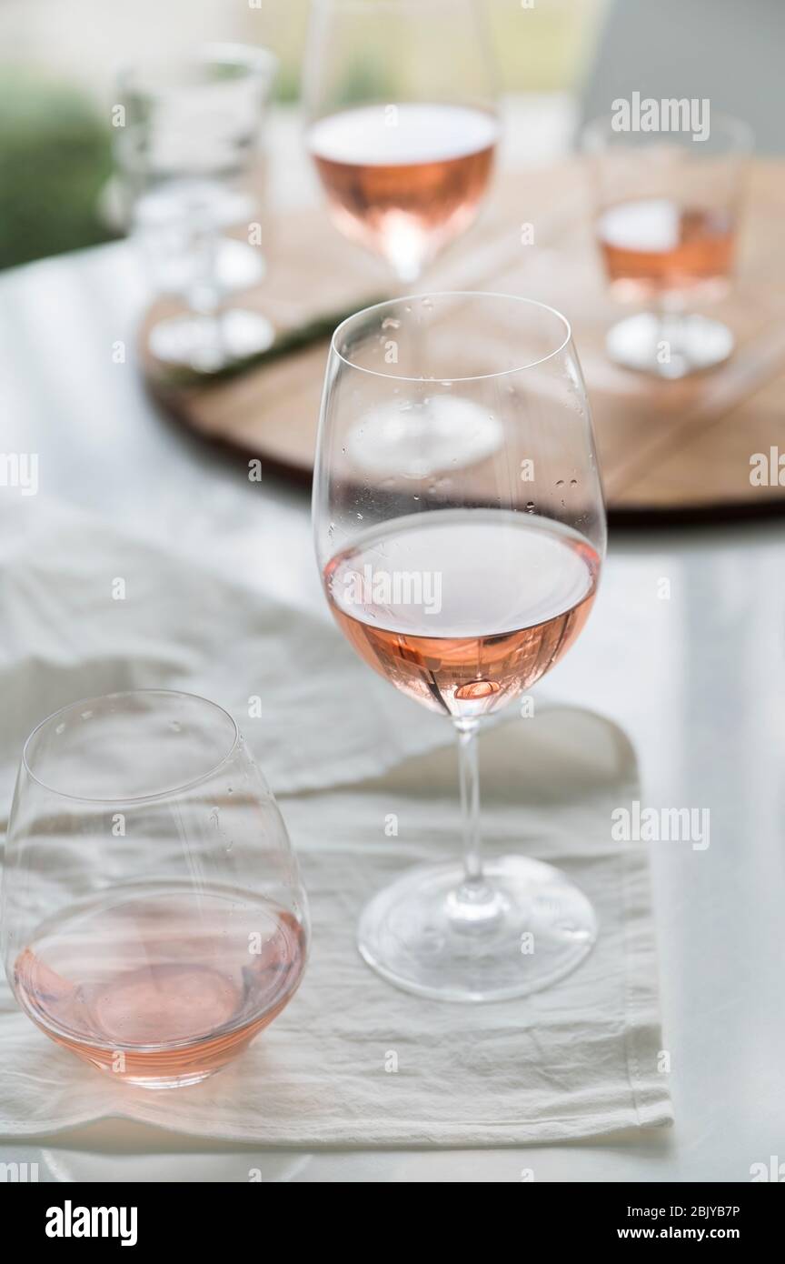 Glasses of rose wine on table Stock Photo
