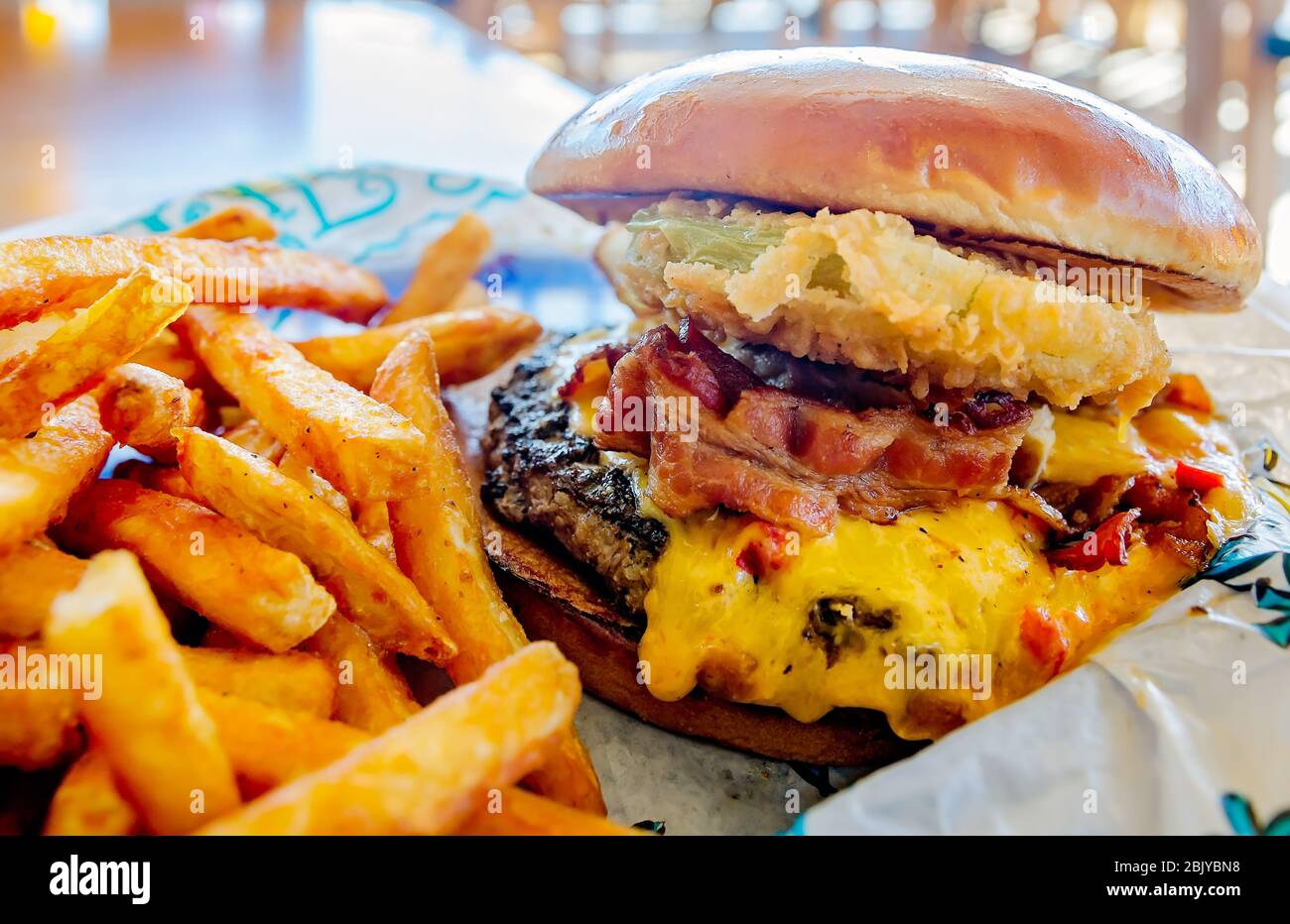 The Pa-Menna cheeseburger, with pimiento cheese, bacon, and fried green  tomatoes, is served at Lulu's Sunset Grill in Gulf Shores, Alabama Stock  Photo - Alamy