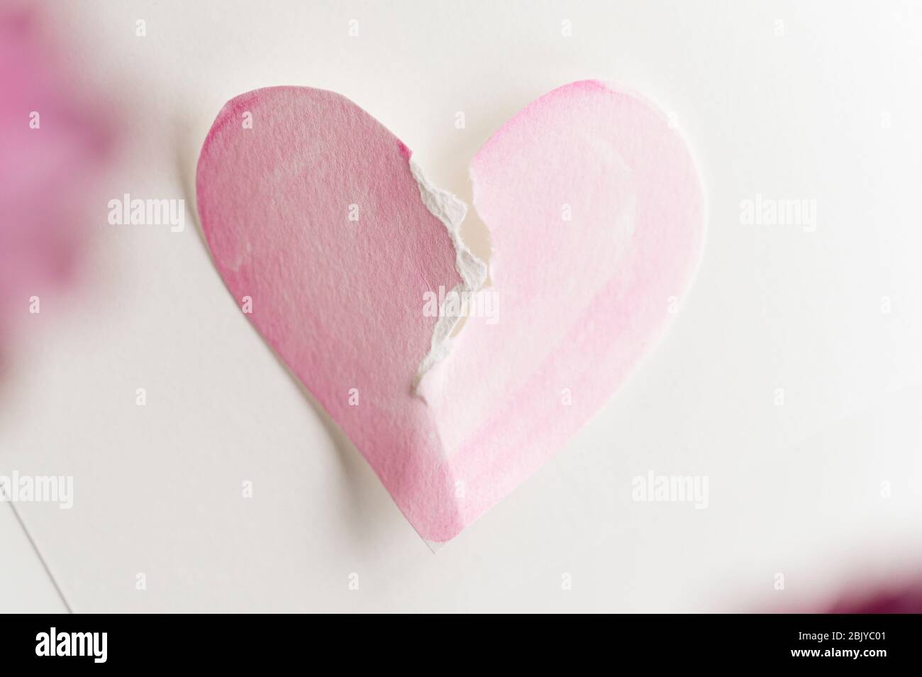 Paper heart ripped in half Stock Photo - Alamy