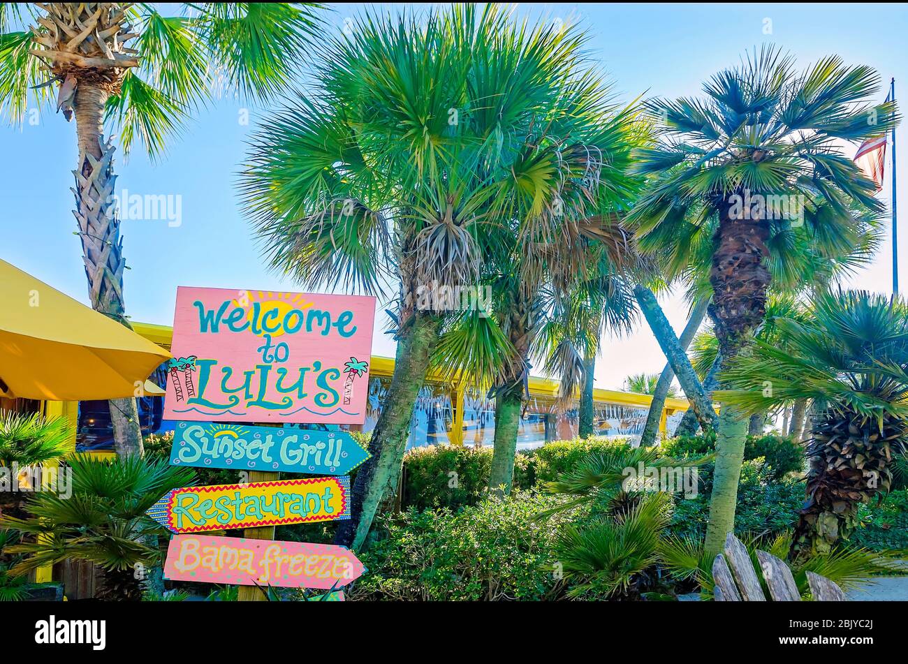 A sign welcomes tourists to Lulu’s Sunset Grill restaurant, March 4, 2016, in Gulf Shores, Alabama. Stock Photo