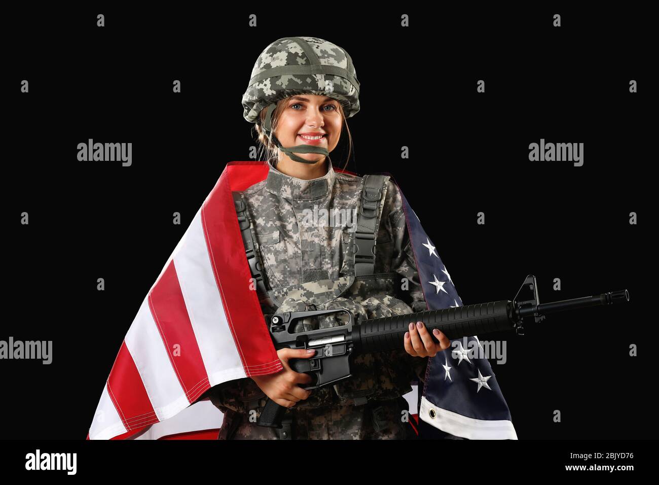 Young female soldier with USA flag on dark background Stock Photo - Alamy