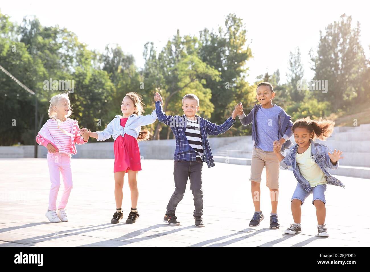 Group of jumping children outdoors Stock Photo