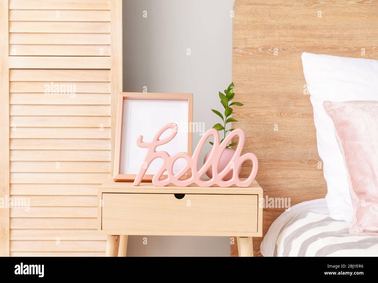 Wooden Bedside Table With Stylish Decor In Room Stock Photo Alamy