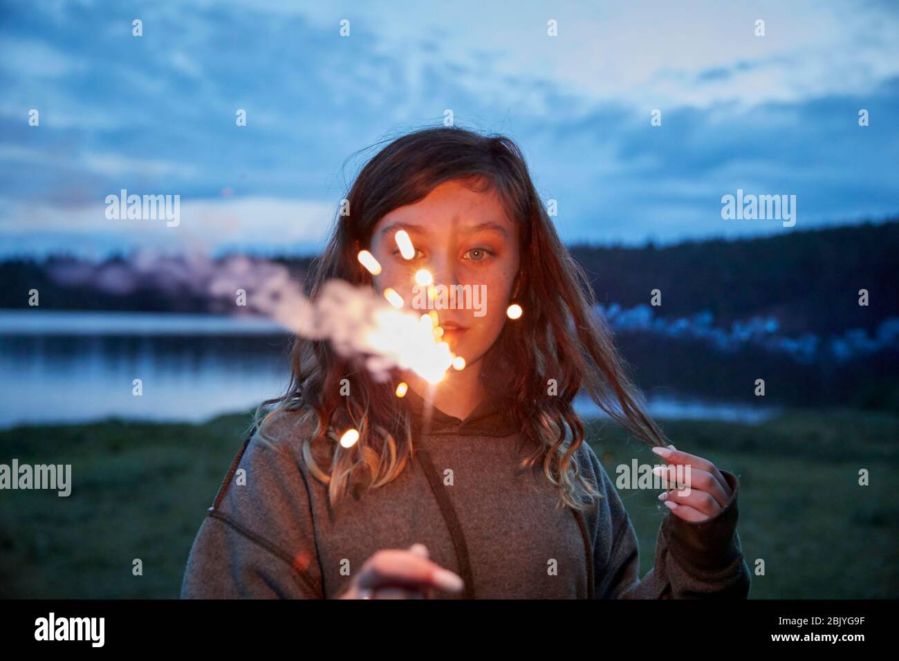 Girl with sparkler Stock Photo
