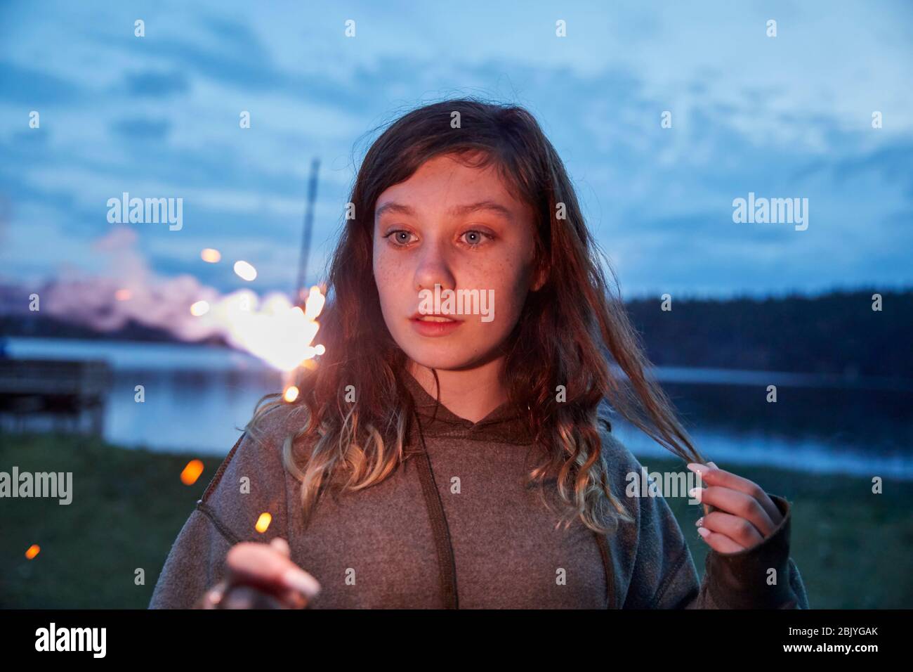 Girl with sparkler Stock Photo