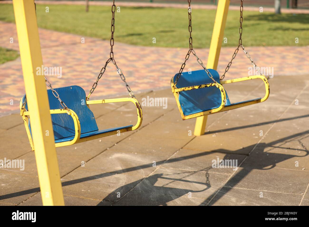 Swings on playground in park Stock Photo Alamy