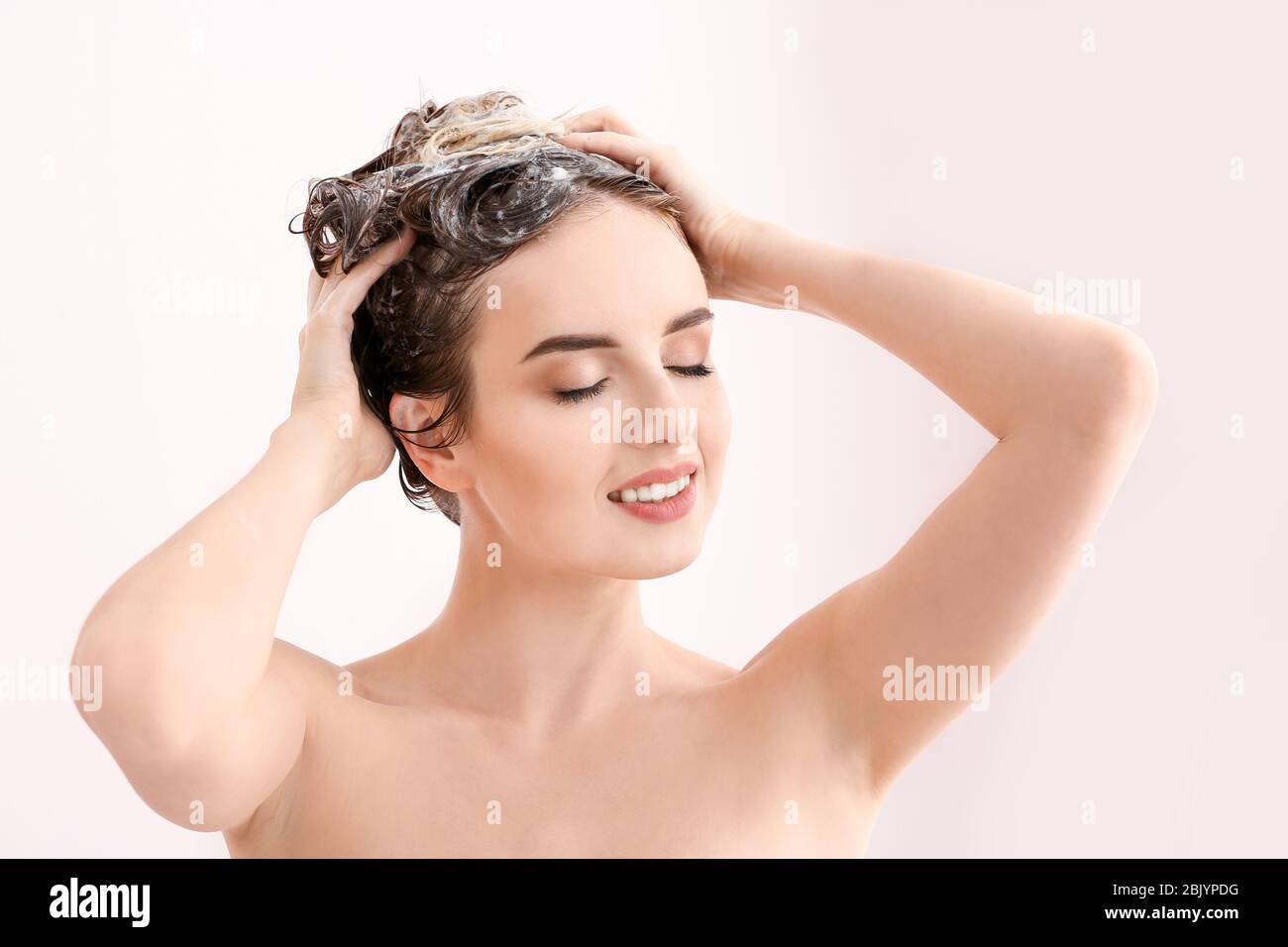 Beautiful young woman washing hair in shower Stock Photo Alamy