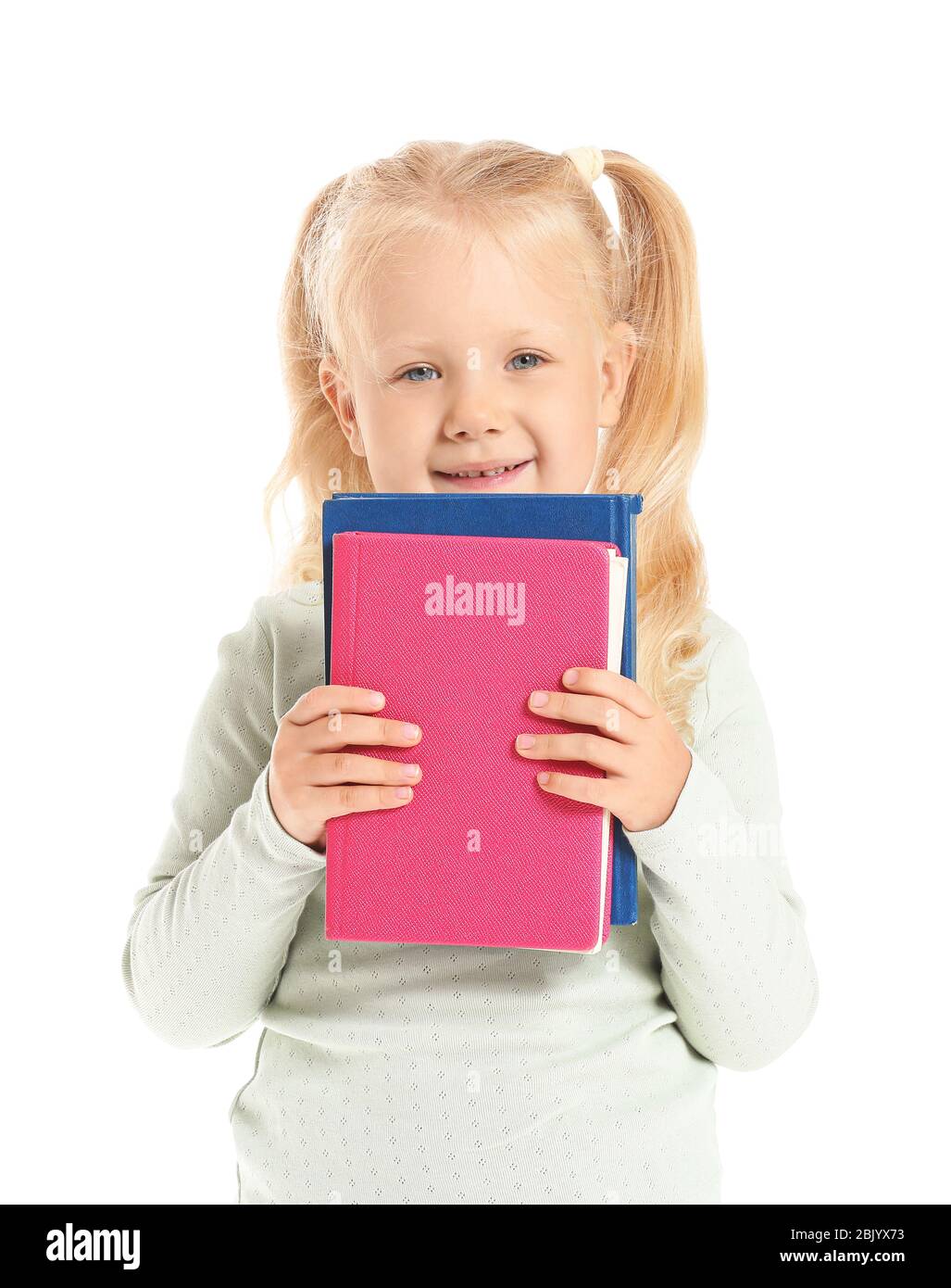 Cute little girl with books on white background Stock Photo - Alamy