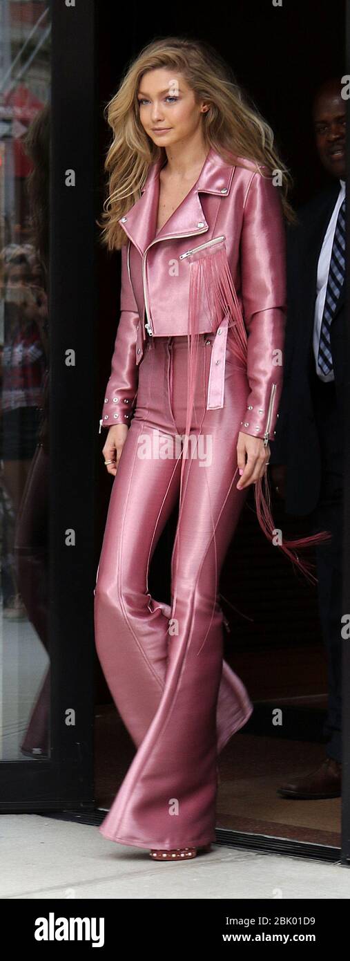 Gigi Hadid wearing a pink outfit as she returns to her apartment in New  York City