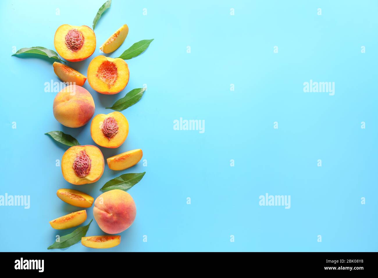 Ripe peaches on color background Stock Photo - Alamy