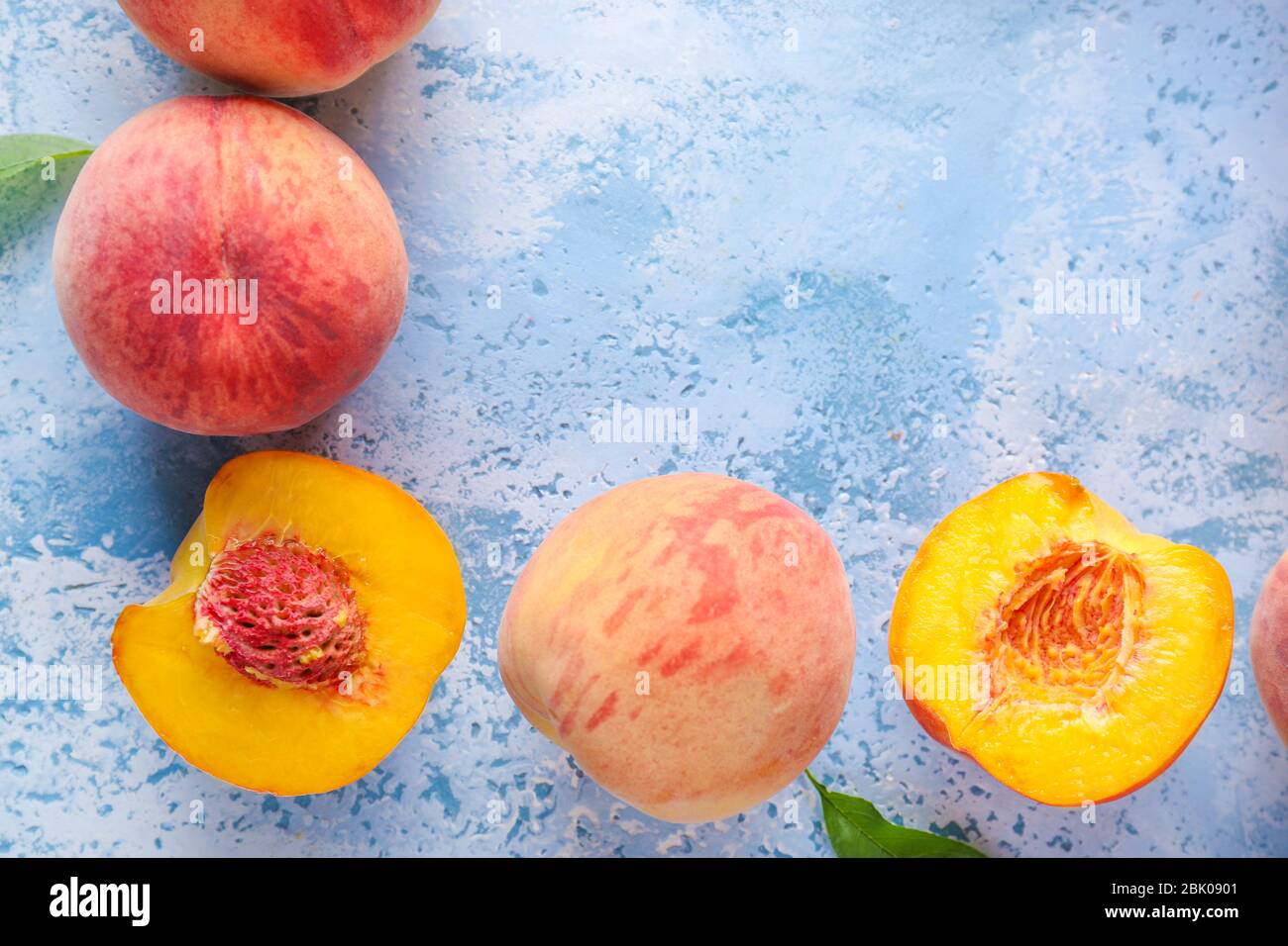 Ripe peaches on color background Stock Photo - Alamy