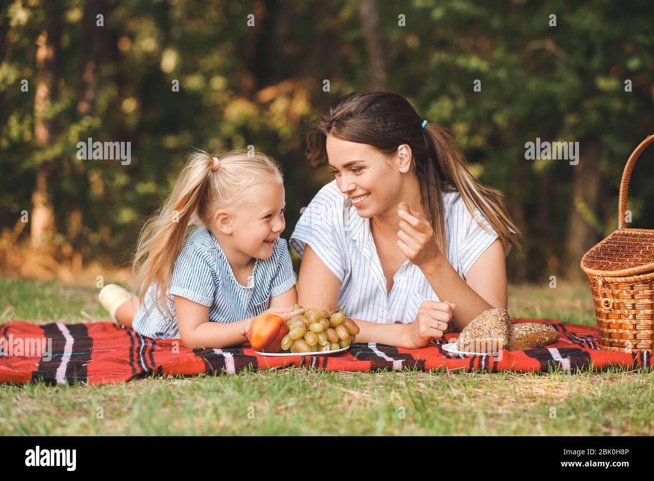 Happy mother and daughter at picnic outdoors Stock Photo - Alamy
