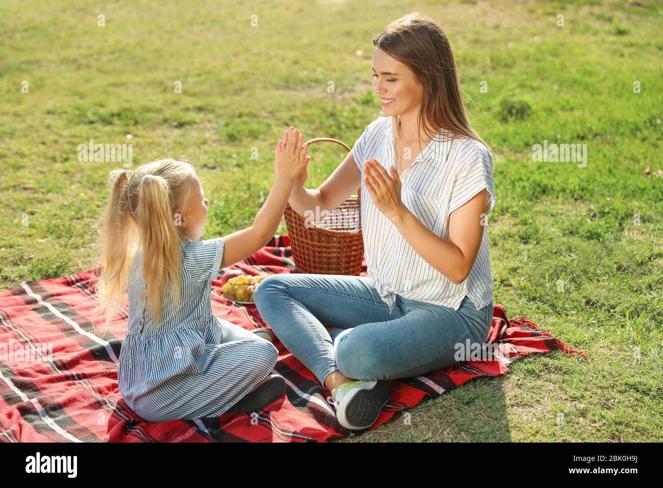 Happy mother and daughter at picnic outdoors Stock Photo - Alamy