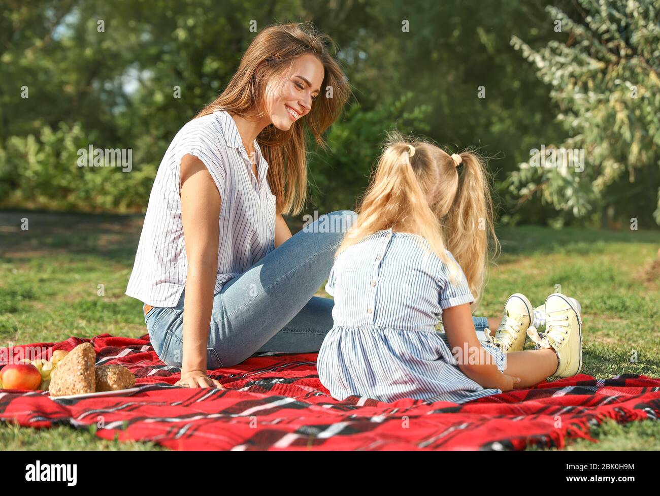 Happy mother and daughter at picnic outdoors Stock Photo - Alamy