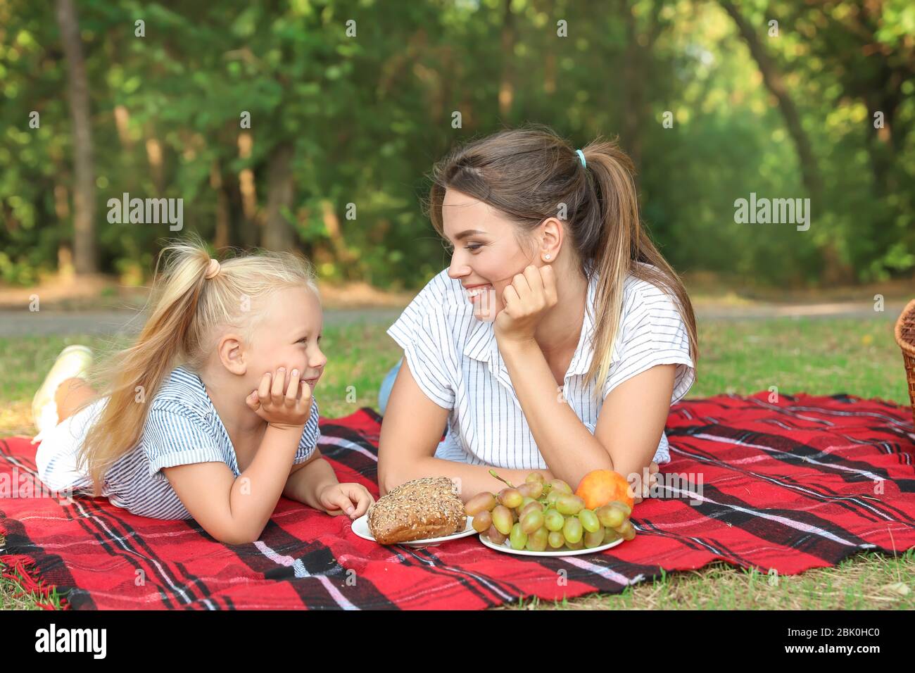 Happy mother and daughter at picnic outdoors Stock Photo - Alamy