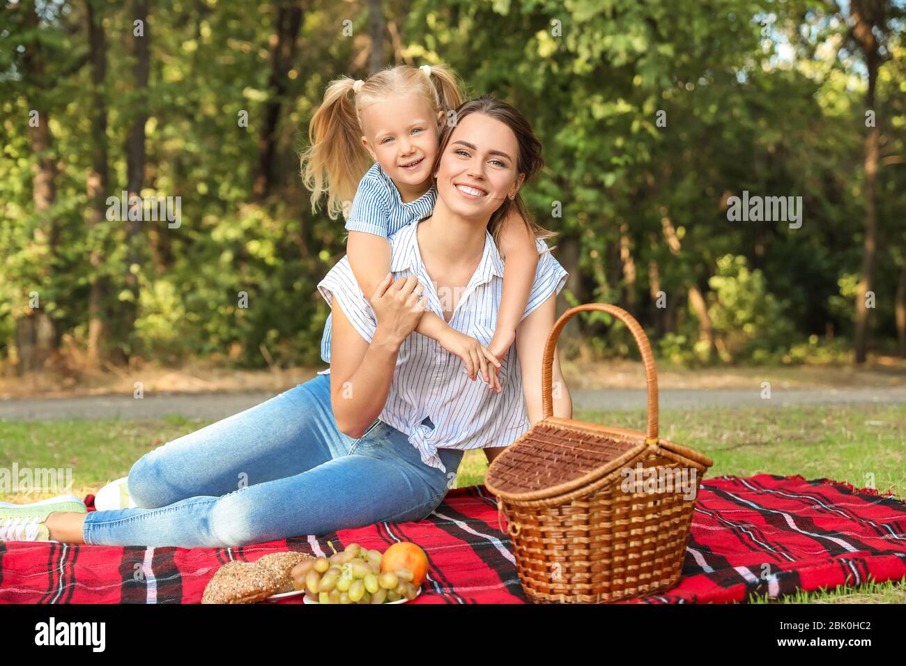 Happy mother and daughter at picnic outdoors Stock Photo - Alamy