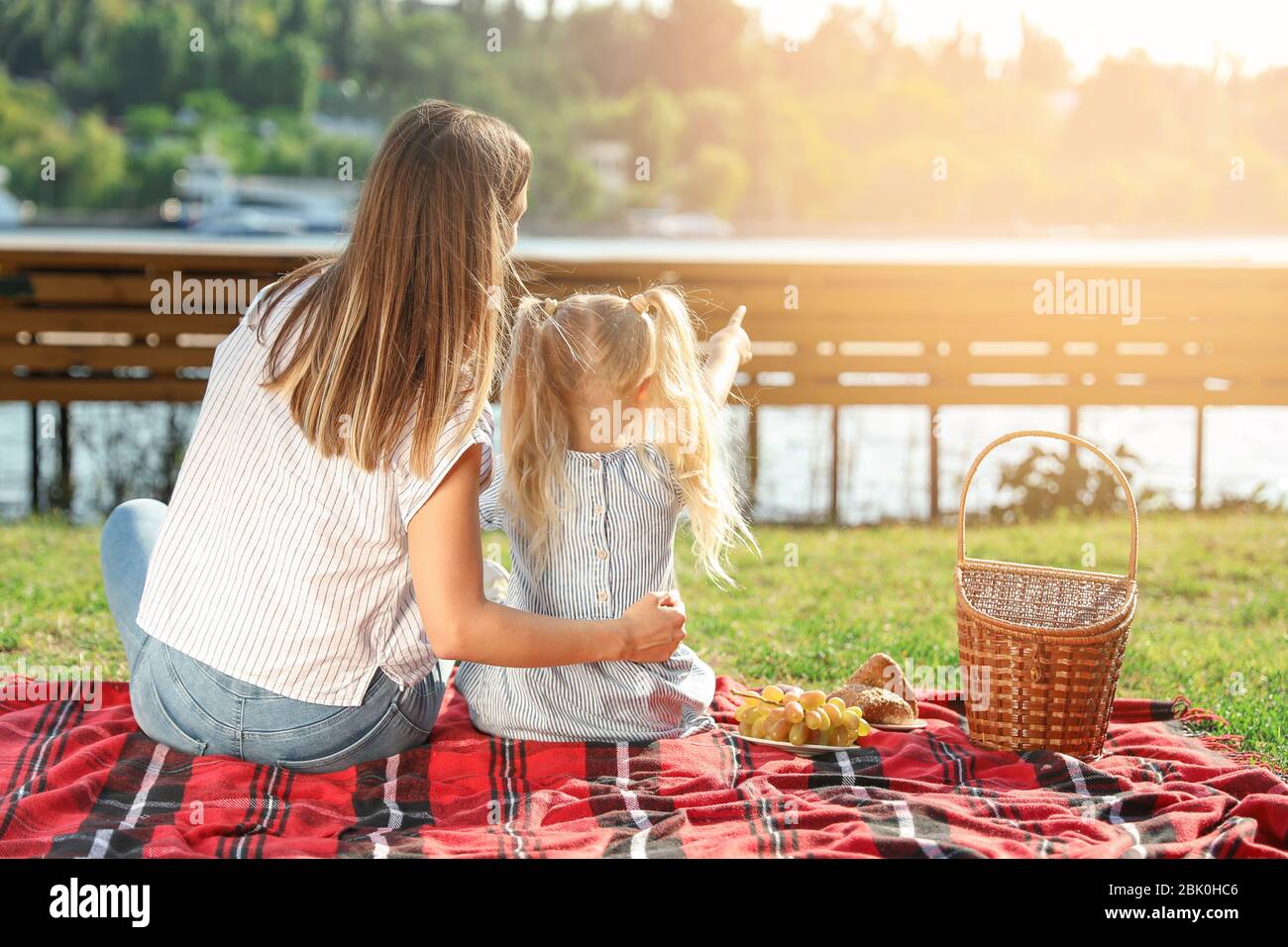 Happy mother and daughter at picnic outdoors Stock Photo - Alamy